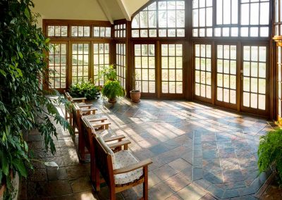 Light, airy and leafy conservatory at the Krishnamurti Centre